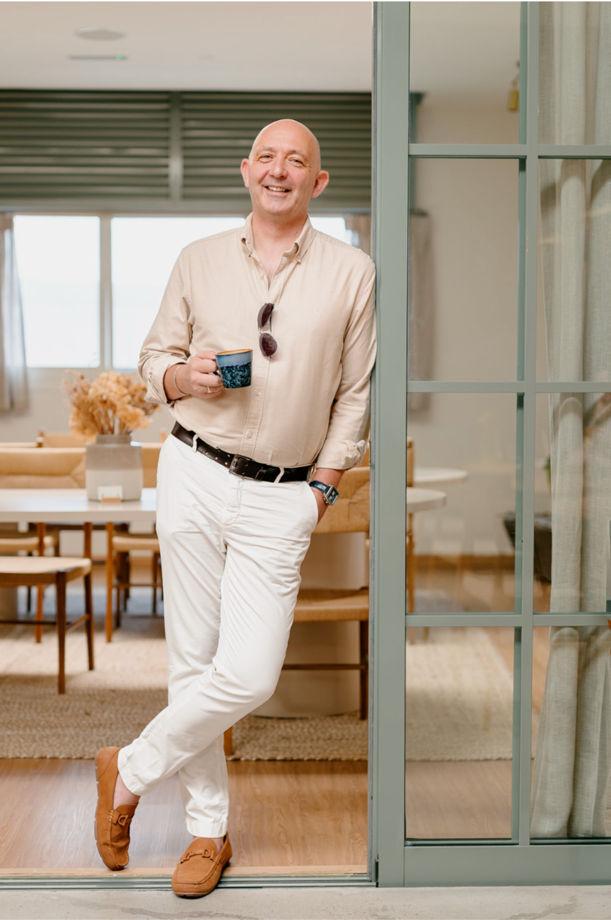 Movi founder Kevin Martin, standing in the doorway of a bright open-plan interior.